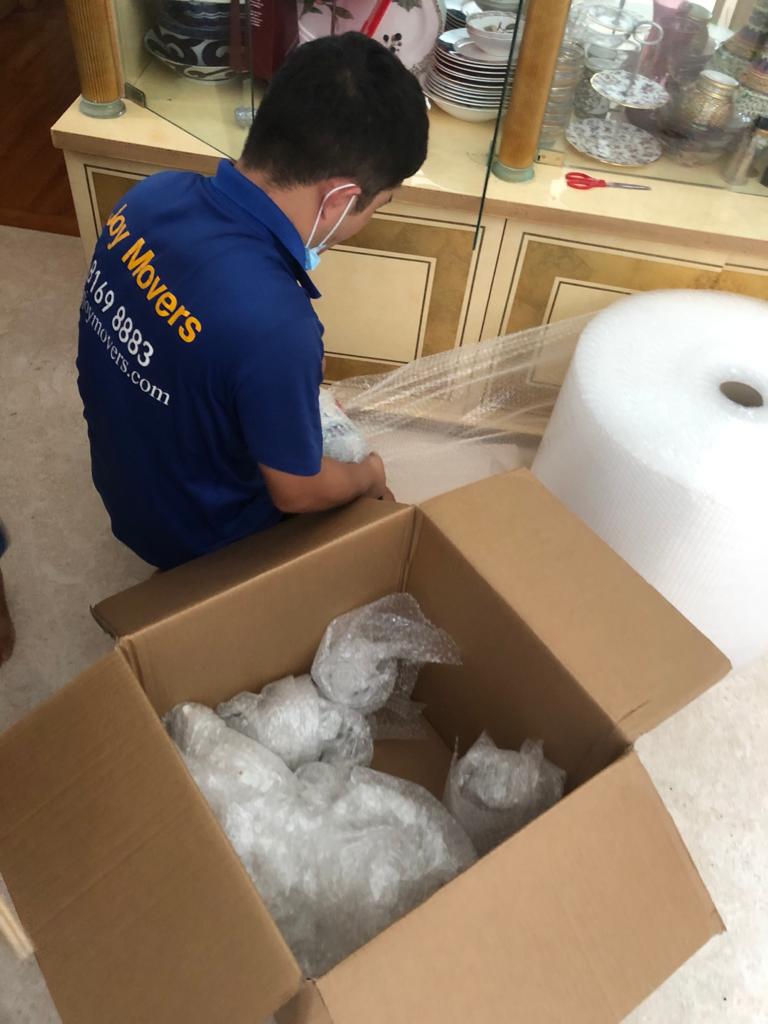 wrapping house items in bubble wrap